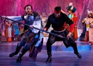 Pictured: In the colorful kingdom of Pentapolis, Pericles (Jon Barker) battles a knight (Jordan Laroya) during Princess Thaisa’s birthday tournament. Photo:  ©Jerry Dalia, The Shakespeare Theatre of New Jersey.